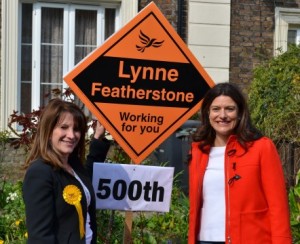 Lynne Featherstone and Miriam Gonzalez Durantez with the 500th Lib Dem stakeboard